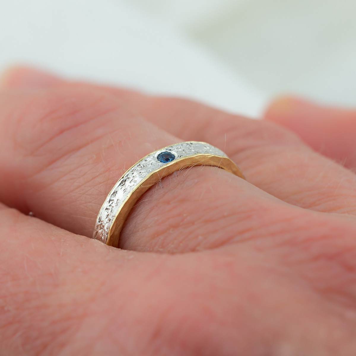 Textured Silver and 18ct Gold Sea Inspired Sapphire Wedding Ring Hand | Lisa Rothwell-Young