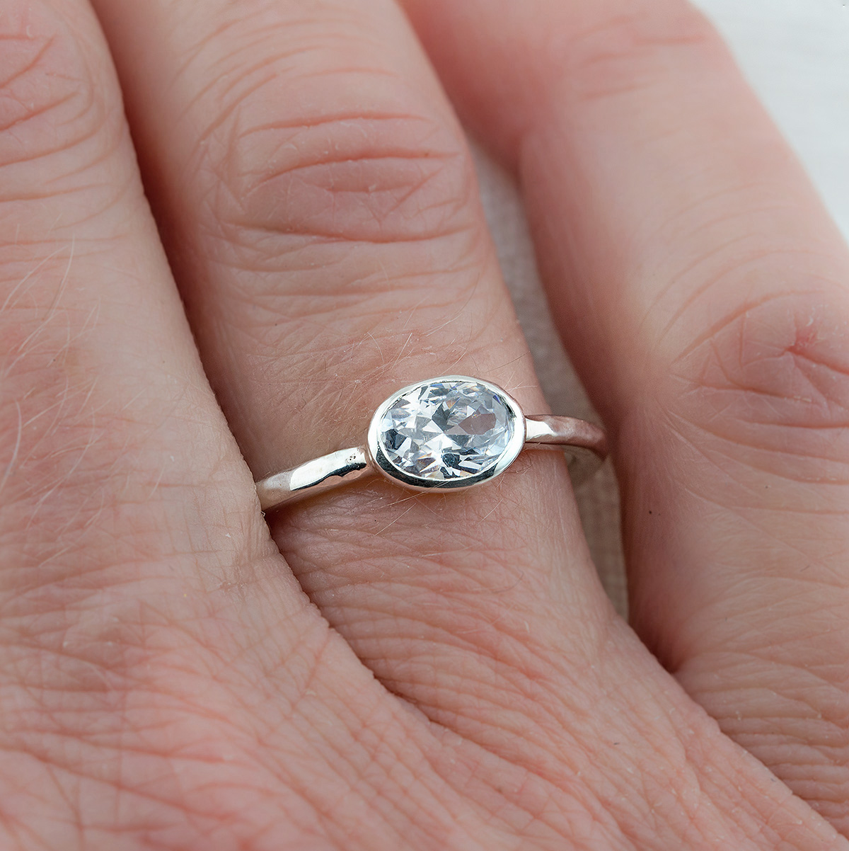 Ocean Inspired Ripple Textured Oval Diamond Engagement Ring Hand | Lisa Rothwell-Young