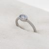 Platinum and pale blue sapphire engagement ring side view