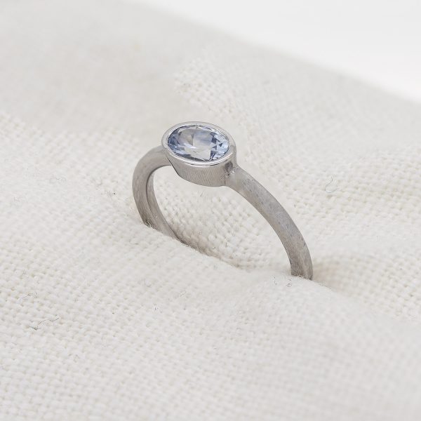 Platinum and pale blue sapphire engagement ring side view