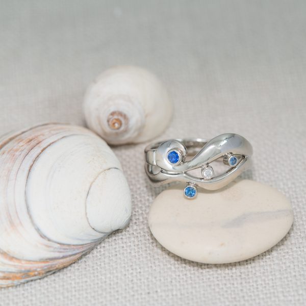 Unconventional Flow Engagement Ring Inspired By The Way Water Flows Around Pebbles On The Beach.