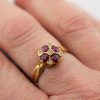 Ruby and diamond quatrefoil ring on hand |Lisa Rothwell-Young