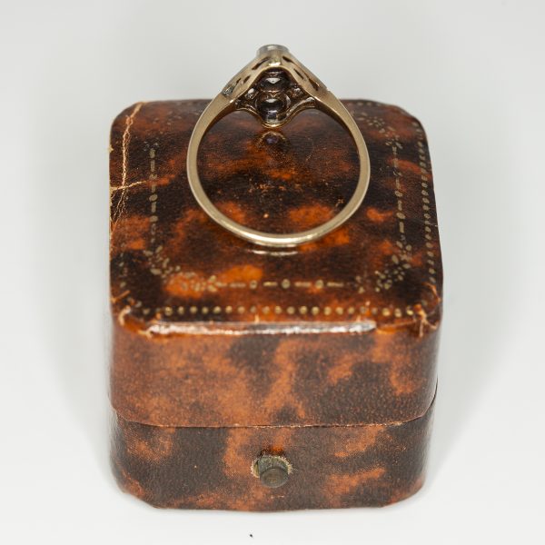 Navette shaped white and yellow gold cluster ring rear view