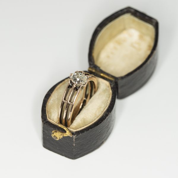 15ct yellow gold three bar ring with an old mine cut diamond in an antique box