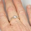 Three stone antique diamond trilogy ring on hand|Lisa Rothwell-Young