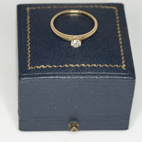 A yellow gold and diamond vintage solitaire ring front view